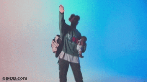 A Person Is Dancing In Front Of A Blue Background GIF