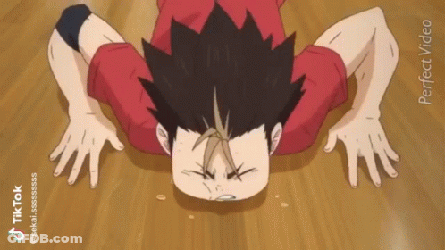 A Person Is Doing Push Ups On A Wooden Floor . GIF