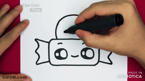 A Person Is Drawing A Candy Bar With A Black Marker On A Piece Of Paper GIF