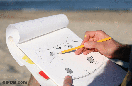 A Person Is Drawing A Cat With A Yellow Pencil On A Piece Of Paper GIF