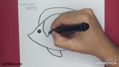 A Person Is Drawing A Fish On A Piece Of Paper With The Words Draw Cute Things On The Bottom GIF