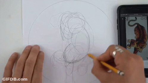 A Person Is Drawing A Picture Of A Tiger With A Pencil GIF