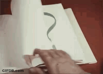 A Person Is Drawing A Question Mark On A Piece Of Paper With A Pen . GIF