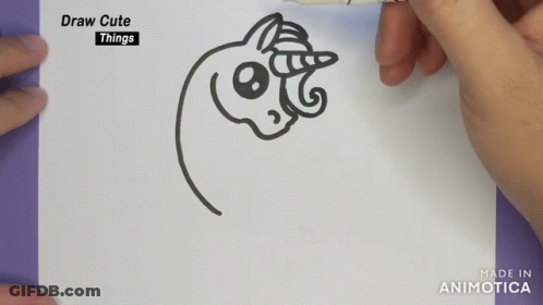 A Person Is Drawing A Unicorn On A Piece Of Paper With A Marker GIF