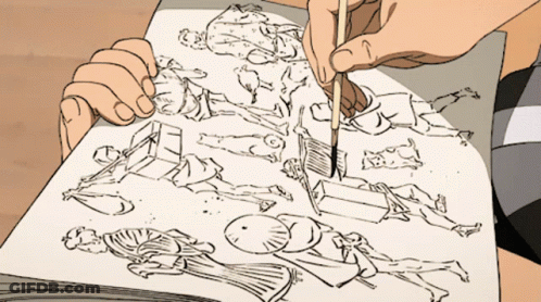 A Person Is Drawing On A Piece Of Paper With A Brush GIF