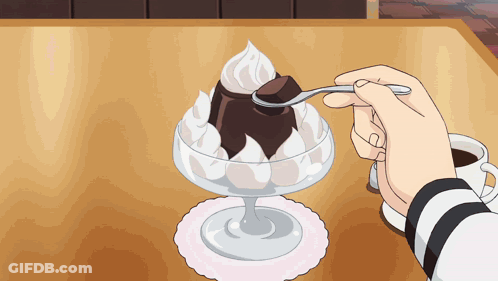 A Person Is Eating A Dessert With A Spoon And A Cup Of Coffee GIF