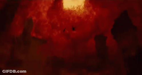 A Person Is Falling Through A Hole In The Ground In A Fire Explosion . GIF