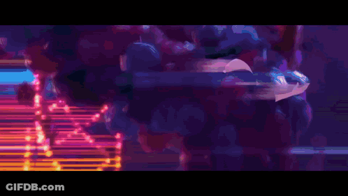 A Person Is Falling Through The Air In A Purple And Blue Background GIF