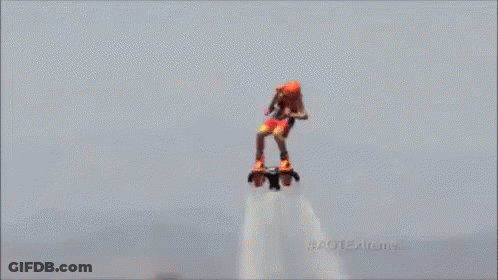 A Person Is Flying Through The Air On A Water Jet GIF