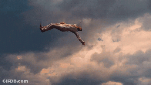 A Person Is Flying Through The Air With A Sword In Their Hand GIF