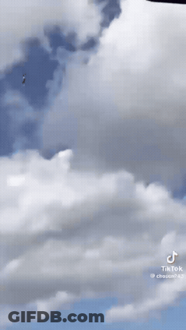 A Person Is Flying Through The Air With A Tiktok Watermark GIF