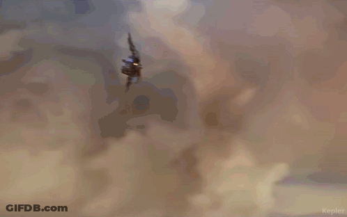 A Person Is Flying Through The Air With The Word Kepler In The Lower Right Corner GIF
