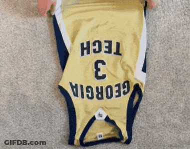 A Person Is Folding A Jersey With The Number 3 On It GIF