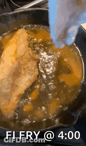 A Person Is Frying A Piece Of Meat In A Skillet With The Words " Fi Fry @ 4:00 " On The Bottom GIF