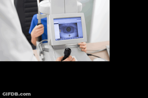 A Person Is Getting Their Eyes Examined By A Doctor GIF