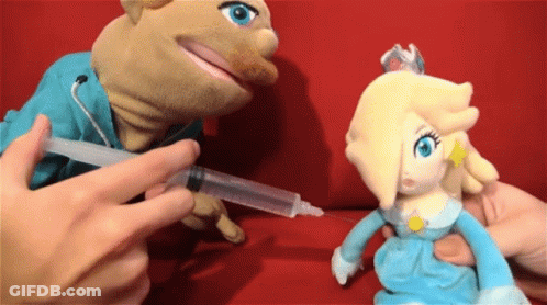 A Person Is Giving A Stuffed Animal A Syringe GIF