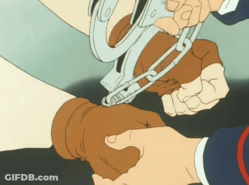 A Person Is Handcuffed To Another Person 'S Arm GIF