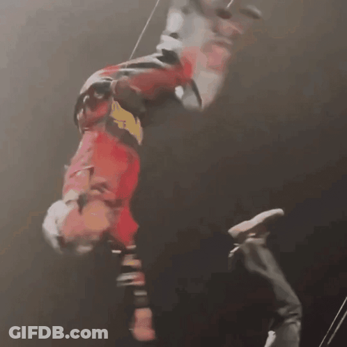 A Person Is Hanging Upside Down In The Air GIF