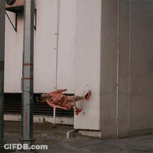 A Person Is Hanging Upside Down Near A Pole That Has Bns1 Written On It GIF