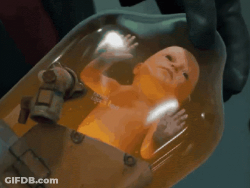 A Person Is Holding A Baby In A Container That Says ' I 'M A Robot ' On The Bottom GIF