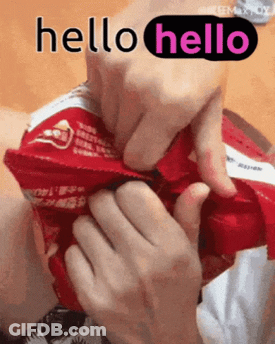 A Person Is Holding A Bag Of Chips And Says Hello GIF