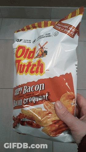 A Person Is Holding A Bag Of Crispy Bacon Crackers GIF