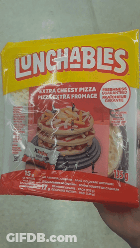A Person Is Holding A Bag Of Lunchables Extra Cheesy Pizza GIF