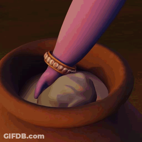 A Person Is Holding A Ball Of Dough Over A Brown Bowl GIF