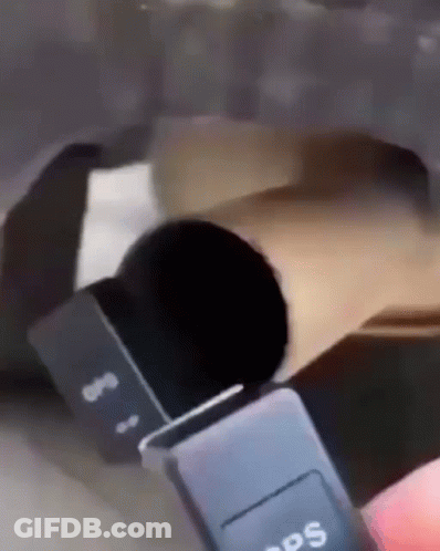 A Person Is Holding A Black Gps Device In Their Hand GIF