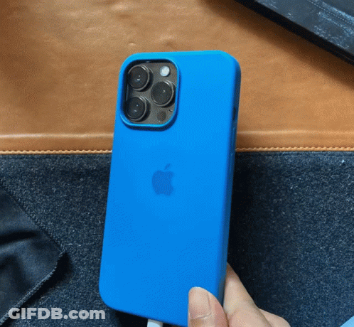 A Person Is Holding A Blue Apple Phone GIF