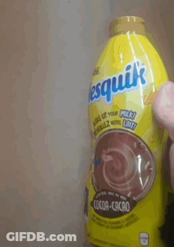 A Person Is Holding A Bottle Of Nesquik Cocoa Cacao GIF
