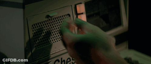 A Person Is Holding A Bottle Of Water In Front Of A Microwave Oven GIF