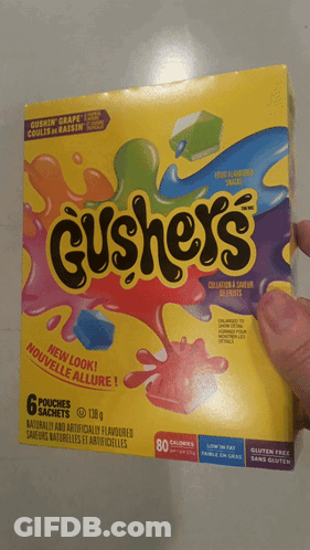 A Person Is Holding A Box Of Cushey 'S In Their Hand GIF