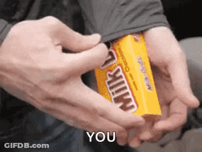 A Person Is Holding A Box Of Milky Way Candy And Says You GIF