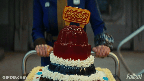A Person Is Holding A Cake With A Congratulations Sign On Top GIF
