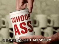 A Person Is Holding A Can Of Whoop Ass . GIF