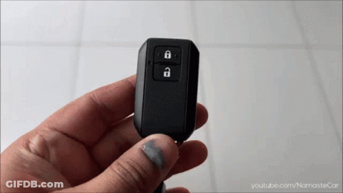 A Person Is Holding A Car Key Fob With A Youtube.com Logo In The Corner GIF