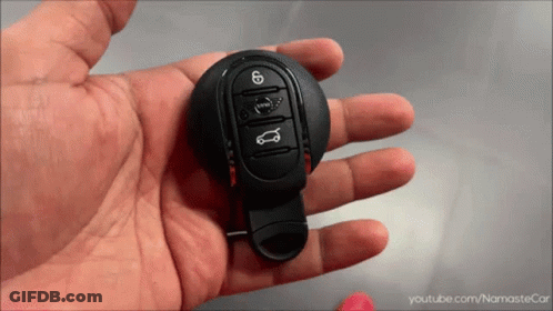 A Person Is Holding A Car Key In Their Hand With Youtube.com/namastecar Written On The Bottom GIF