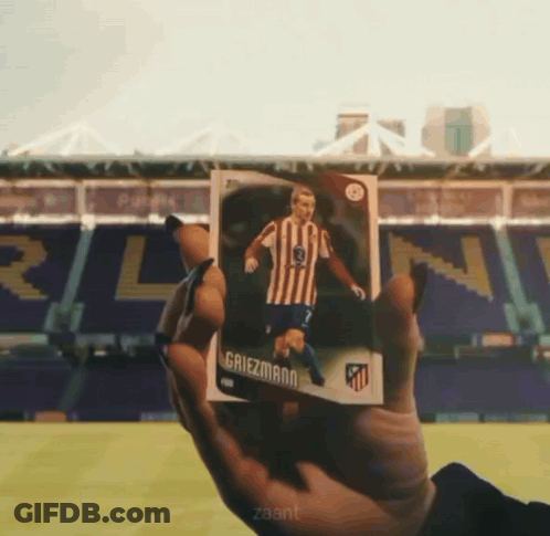 A Person Is Holding A Card That Says Griezmann On It GIF