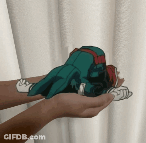 A Person Is Holding A Cartoon Character In Their Palms GIF
