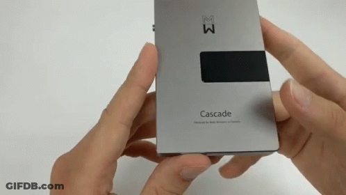 A Person Is Holding A Cascade Device In Their Hand GIF