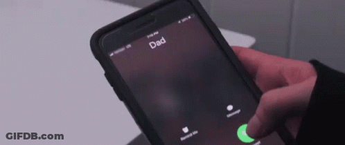 A Person Is Holding A Cell Phone Which Says Dad On The Screen GIF