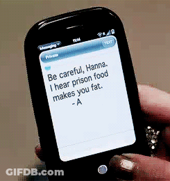 A Person Is Holding A Cell Phone With A Message On It GIF