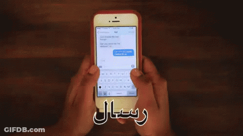 A Person Is Holding A Cell Phone With A Message On The Screen GIF