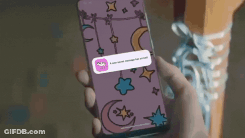 A Person Is Holding A Cell Phone With A New Secret Message On It GIF