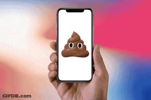 A Person Is Holding A Cell Phone With A Poop Emoji On It GIF