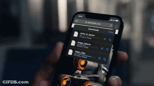 A Person Is Holding A Cell Phone With Sketchfab.com On It GIF