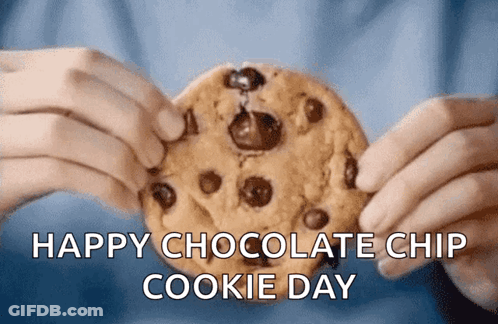 A Person Is Holding A Chocolate Chip Cookie With The Words Happy Chocolate Chip Cookie Day GIF