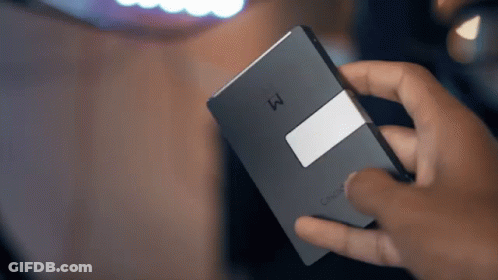 A Person Is Holding A Cisco Device In Their Right Hand GIF