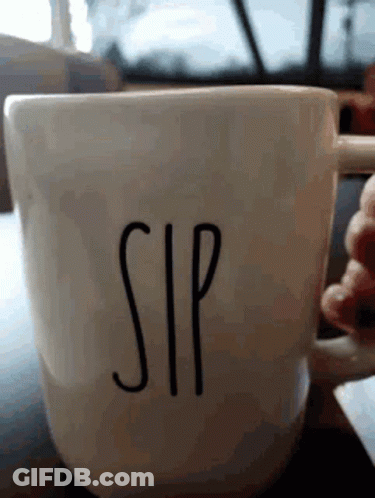 A Person Is Holding A Coffee Cup That Says Sip On It GIF